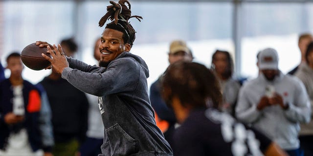 Former NFL and Auburn quarterback, Cam Newton, throws a pass during Auburn Pro Day, Tuesday, March 21, 2023, in Auburn, Ala.