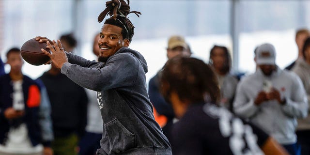 Former NFL and Auburn quarterback Cam Newton throws a pass during Auburn Pro Day, Tuesday, March 21, 2023, in Auburn, Alabama.