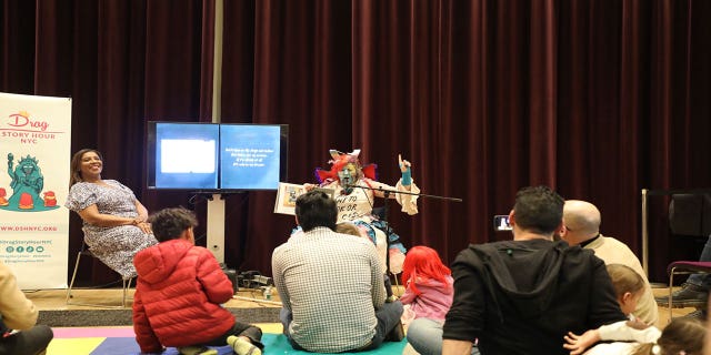 An image of a drag queen reading at a drag queen story hour hosted by New York Attorney General Letitia James on Sunday.