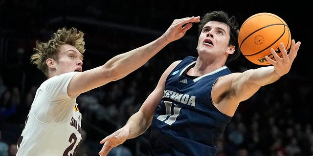 Nevada's Nick Davidson shoots against Arizona State's Duke Brennan during the first half of a First Four college basketball game in the NCAA men's basketball tournament, Wednesday, March 15, 2023, in Dayton, Ohio. 