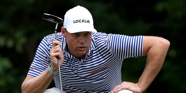 Nick Watney of the U.S. lines up a putt on the eighth green during the final round of the Rocket Mortgage Classic at Detroit Golf Club July 31, 2022, in Detroit.