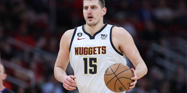 Feb 28, 2023; Houston, Texas, USA; Denver Nuggets center Nikola Jokic (15) brings the ball up the court during the third quarter against the Houston Rockets at Toyota Center.