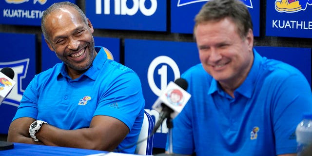Assistant coach Norm Roberts of the Jayhawks listens to head coach Bill Self during post-game interviews after their 94-63 win over the Pittsburg State Gorillas at Allen Fieldhouse on Nov. 3, 2022, in Lawrence, Kansas.