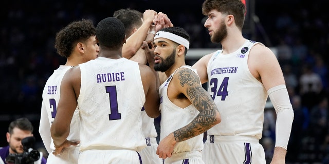 Boo Buie #0 of the Northwestern Wildcats huddles with the team during the first half of a game against the Boise State Broncos in the first round of the NCAA Men's Basketball Tournament at Golden 1 Center on March 16, 2023 in Sacramento, California.