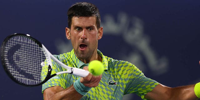 Novak Djokovic in action against Daniil Medvedev in a men's singles semifinal match at Dubai Duty Free Tennis Stadium March 3, 2023, in Dubai, United Arab Emirates.