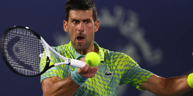 Novak Djokovic in action against Daniil Medvedev in a men's singles semifinal match at Dubai Duty Free Tennis Stadium March 3, 2023, in Dubai, United Arab Emirates.