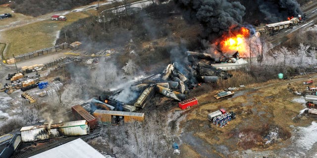 This photo taken with a drone shows portions of a Norfolk Southern freight train that derailed Feb. 3, in East Palestine, Ohio, still on fire Feb. 4, 2023.