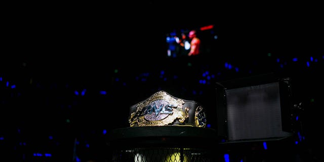 A One Championship belt sits near the cage during The One: Kings &amp; Conquerors event at the Venetian Macao in Macau, on Saturday, Aug. 5, 2017.