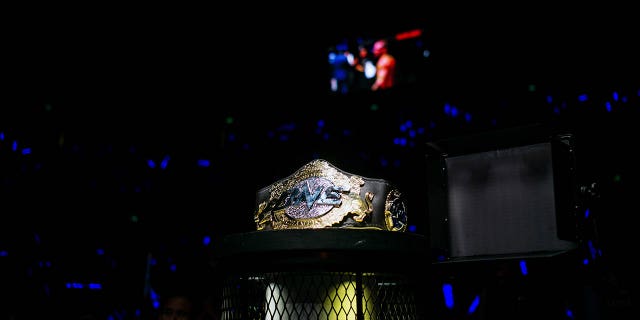 A One Championship belt sits near the cage during The One: Kings & Conquerors event at the Venetian Macao in Macau, on Saturday, Aug. 5, 2017.