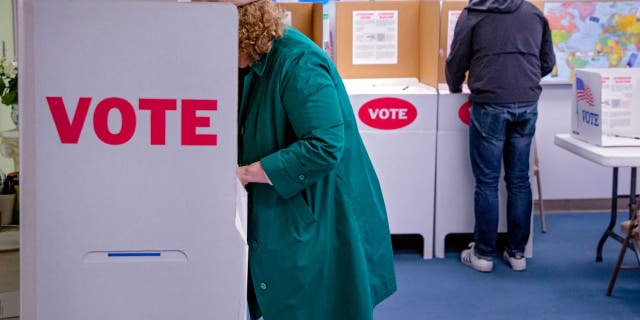 People fill out ballots at Northwest Baptist Church in Oklahoma City Feb. 14, 2023.