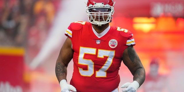 Orlando Brown Jr. #57 of the Kansas City Chiefs runs onto the field during introductions against the Jacksonville Jaguars at GEHA Field at Arrowhead Stadium on January 21, 2023, in Kansas City, Missouri.