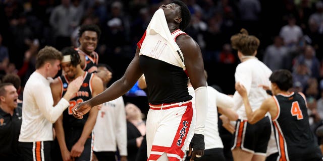 Oumar Ballo (11) of the Arizona Wildcats reacts after the Princeton Tigers celebrate their upset of Arizona in the first round of the NCAA men's basketball tournament at Golden 1 Center March 16, 2023, in Sacramento, Calif.