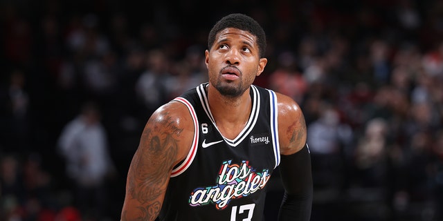 Paul George #13 of the LA Clippers looks on during the game against the Portland Trail Blazers on March 19, 2023 at the Moda Center Arena in Portland, Oregon.