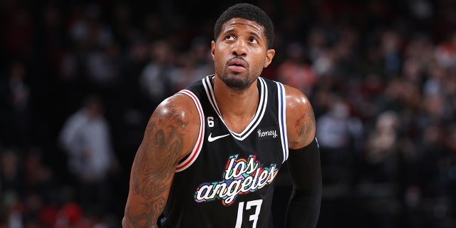 Paul George #13 of the LA Clippers looks on during the game against the Portland Trail Blazers on March 19, 2023 at the Moda Center Arena in Portland, Oregon.