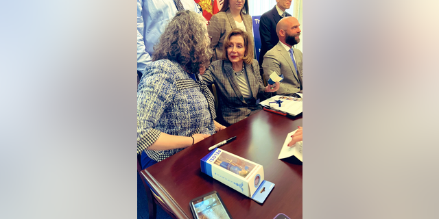 Nancy Pelosi presented an action figure of herself at U.S. Capitol