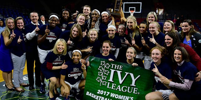 The Pennsylvania Quakers women's basketball team take time for portraits by photographers and fans after the win against the Princeton Tigers in the Ivy League tournament final at The Palestra on March 12, 2017 in Philadelphia