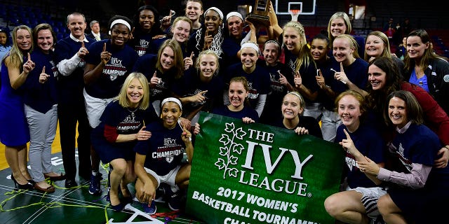 The Pennsylvania Quakers women's basketball team take time for portraits by photographers and fans after the win against the Princeton Tigers in the Ivy League tournament final at The Palestra on March 12, 2017 in Philadelphia