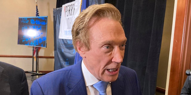 Perry Johnson, a Republican Michigan gubernatorial candidate, spoke with reporters on Feb. 23, 2022, after a kickoff event at a hotel in Lansing, Michigan. He announced Thursday, March 2, 2023 to supporters that he plans to run for president in 2024. 