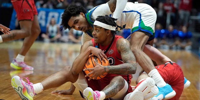 Southeast Missouri State's Phillip Russell grabs a loose ball against Texas A&M Corpus Christi's Simeon Fryer during the first half of a First Four college basketball game in the NCAA men's basketball tournament, Tuesday, March 14, 2023, in Dayton, Ohio.