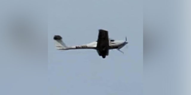 Chris Yates noticed that the 21-year-old Taylor-Hash Diamond DA20-C1 was missing the front landing gear and calmly walked the younger pilot through to land safely.