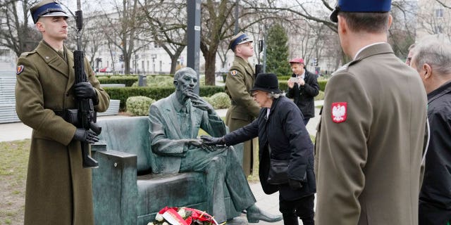 Members of a foundation supporting Poles who saved Jews from the Holocaust honor resistance emissary Jan Karski, who informed western leaders about mass killings of Jews by Nazi Germans, during national day of remembrance of Poles who risked their lives to save Jews, in Warsaw, Poland, on March 24, 2023.