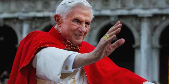 Pope Benedict XVI greets the crowd gathered in St Mark's Square on May 7, 2011, in Venice, Italy. German authorities investigated Pope Benedict XVI on suspicion of being an accessory to abuse.
