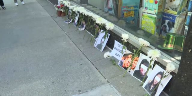 Pictures of victims of the North Korean regime are placed outside the country's U.N. mission in New York.