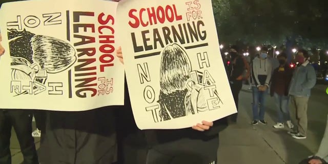 Protesters held signs and sought to disrupt a speech held by the Turning Point USA chapter at UC Davis on March 14, 2023.