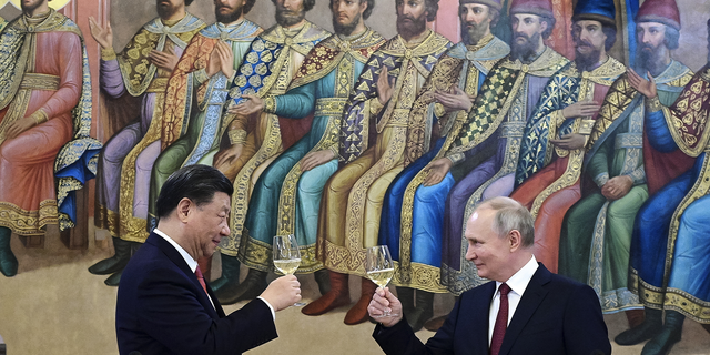 Russian President Vladimir Putin, right, and Chinese President Xi Jinping toast during their dinner at The Palace of the Facets in Moscow March 21, 2023. Russia also criticized the West following that state visit.