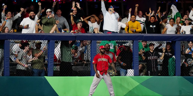 Randy Arozarena #56 of Team Mexico reacts to stealing a solo home run from Kazuma Okamoto #25 of Team Japan in the fifth inning during the 2023 World Baseball Classic Semifinal game at LoanDepot Park on Monday, March 20, 2023. in Miami, Florida.