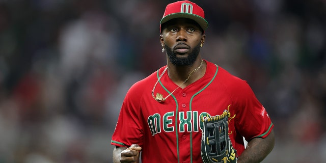 Randy Arozarena #56 of Team Mexico returns to the dugout in the sixth inning against Team Japan during the World Baseball Classic Semifinals at LoanDepot Park on March 20, 2023 in Miami, Florida.