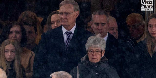 Bill Postle and Bernadette Postle, parents of Rebecca Bliefnick, attend their daughter’s funeral