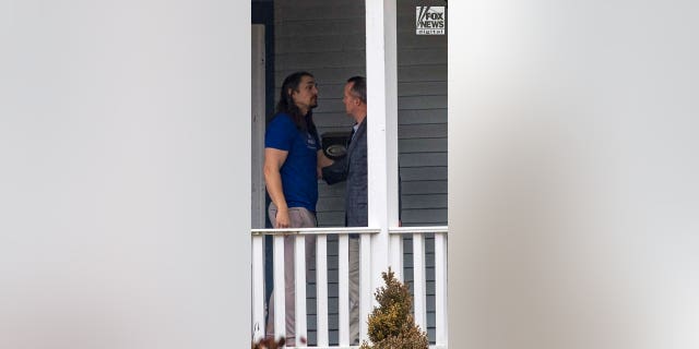 Tim Bliefnick is seen at his home on the day of Rebecca Bliefnick’s funeral on Friday, March 3, 2023 in Quincy, Illinois. He was wearing a T-shirt and sweats by the time family members dropped off the couple's three children, who sat with their mother's side of the family during funeral Mass and attended her burial.