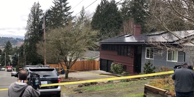 Medical examiners arrived Friday morning, hours after a stalking suspect allegedly shot and killed a podcast host and her husband before killing himself. 