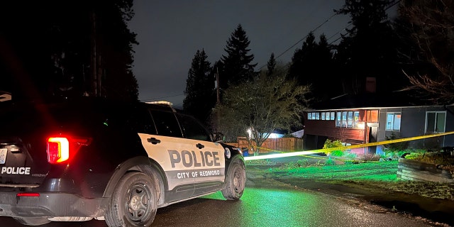 Redmond Police say they arrived around 2 a.m. Friday and attempted CPR on a man with gunshot wounds. Inside, they found a woman and the suspect, also deceased.