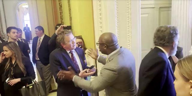 Reps. Thomas Massie, left, and Jamaal Bowman get into a shouting match over gun control legislation while pacing the halls of Congress on Wednesday.