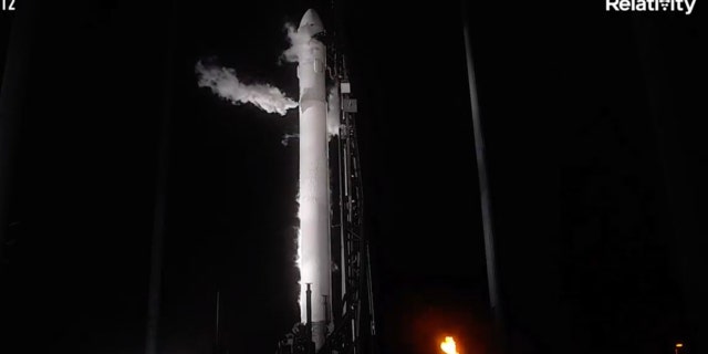 In this frame grab from livestreamed video provided by Relativity Space, Terran 1 sits on a launch pad at Cape Canaveral, Fla., late Wednesday, March 22, 2023. The rocket is made almost entirely of 3D-printed parts.