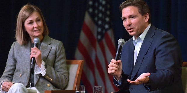 Florida Gov. Ron DeSantis, right, speaks at a campaign event with Iowa Gov. Kim Reynolds on Friday, March 10, 2023, in Davenport, Iowa.