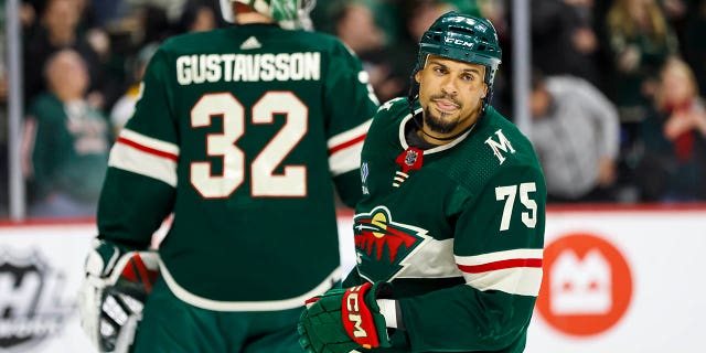 Ryan Reaves, #75 of the Minnesota Wild, watches his goal against the Chicago Blackhawks in the second period of the game at the Xcel Energy Center on March 25, 2023 in St Paul, Minnesota.