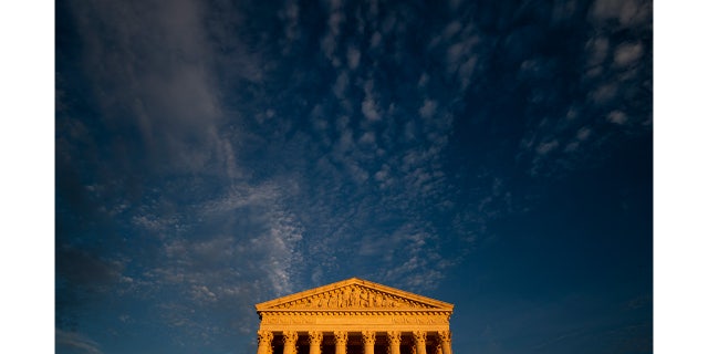 Sunset light illuminates the U.S. Supreme Court building.