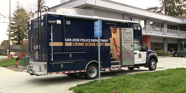 San Jose Police Department Crime Scene Unit truck parked outside where a man wielding a machete held three hostages in San Jose, California.