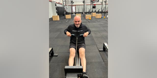 Just a few months after starting CrossFit classes, Hanley (pictured on a rowing machine) said his symptoms disappeared.
