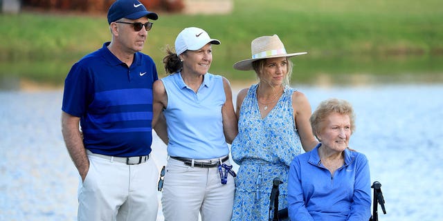 Scottie Scheffler's family watch the presentation, from left to right, his father Scott Scheffler, mother Diane Scheffler, wife Meredith Scheffler and his and grandmother after his one stroke win in the final round of the Arnold Palmer Invitational presented by Mastercard at Arnold Palmer Bay Hill Golf Course on March 06, 2022 in Orlando, Florida.