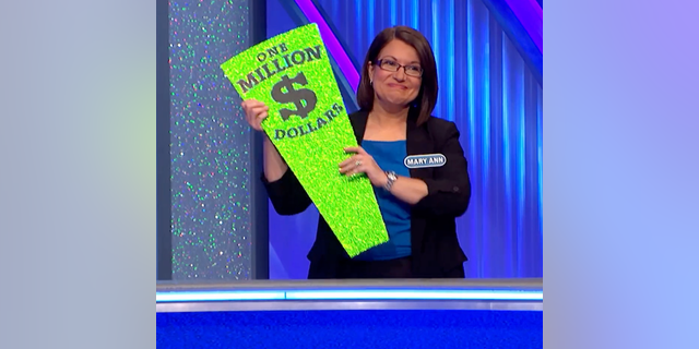 "Wheel of Fortune" contestant Mary Ann picked up the shiny prize proudly after Pat Sajak reminded her of the game rules.