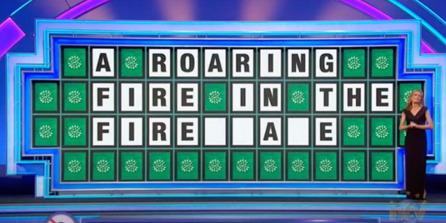 The puzzle for the category "Thing" on the board read "A ROARING FIRE IN THE FIRE _ _ A _ E."