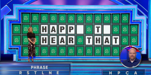 The phrase on the "Wheel of Fortune" letter board spelled out "HAPP_ T_ HEAR THAT," with only two letters missing from the puzzle.
