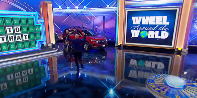 The "Wheel of Fortune" contestant checks out his new car.