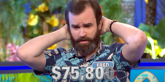 Fred put his hands over his head in shock and let out a big exhalation, while basking in his glory.