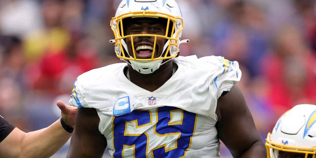 Sebastian Joseph-Day of the Los Angeles Chargers celebrates a sack against the Texans at NRG Stadium on Oct. 2, 2022, in Houston.