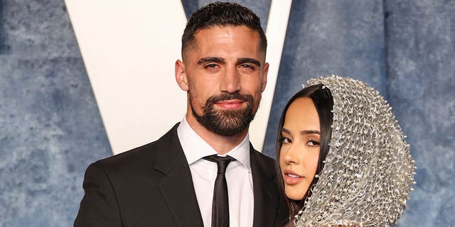 Sebastian Lletget and Becky G attend the 2023 Vanity Fair Oscar Party Hosted By Radhika Jones at Wallis Annenberg Center for the Performing Arts on March 12, 2023 in Beverly Hills, California.
